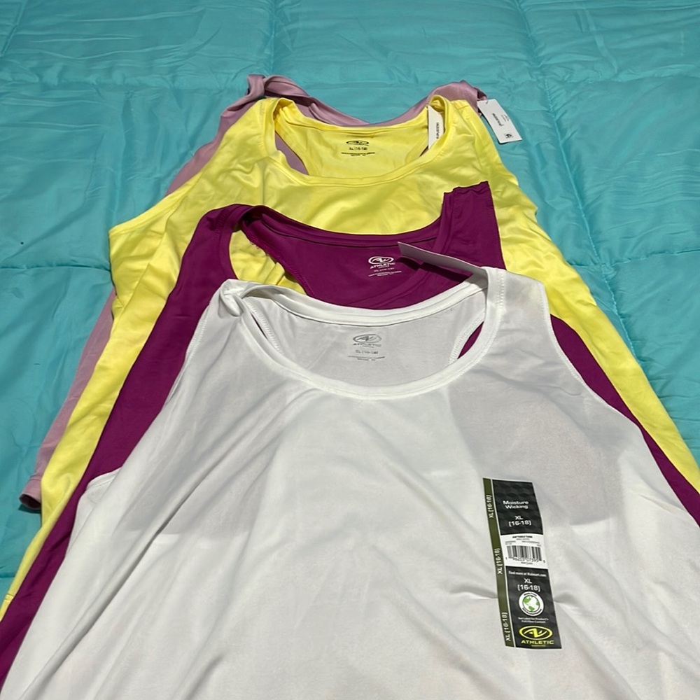 Brand new tank tops.   Selling all 4 together